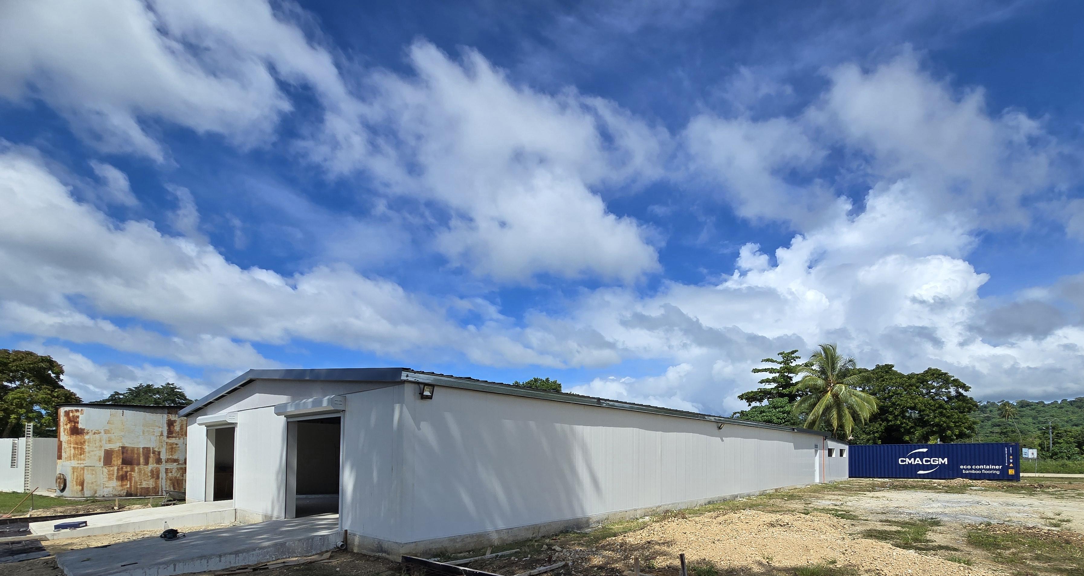 Packhouse outside view with CMA CGM eco container and bamboo flooring